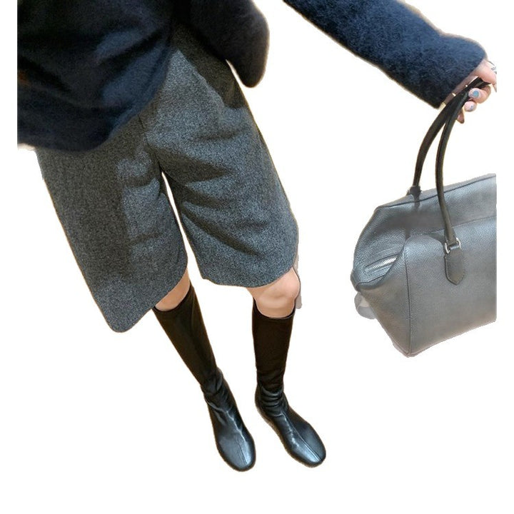 Women’s leather knee-high boots with a slim silhouette and flat heel Mune Fashion