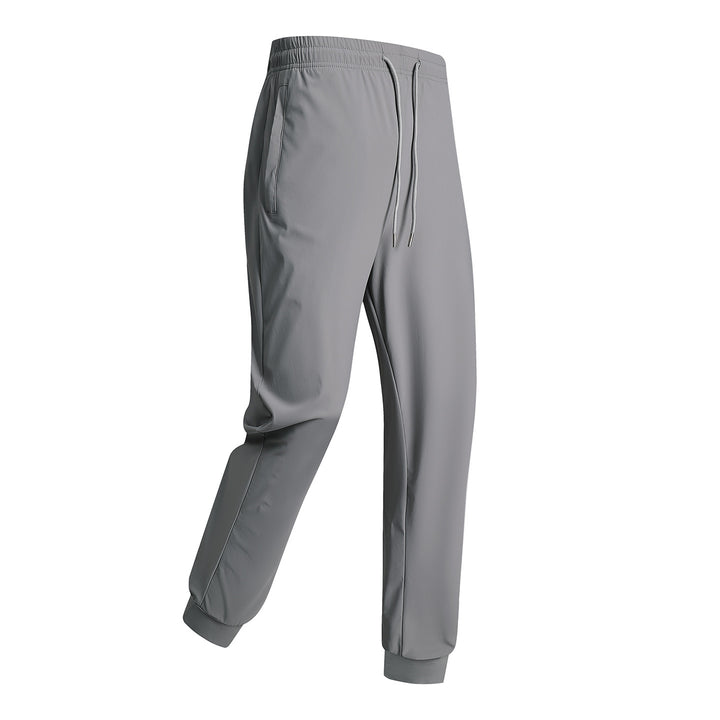Men's sporty training pants with elastic waistband and zippered pockets Mune Fashion