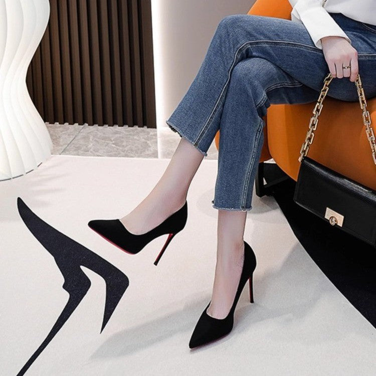 Ladies elegant pointed suede pumps with contrasting red sole and narrow stiletto heel