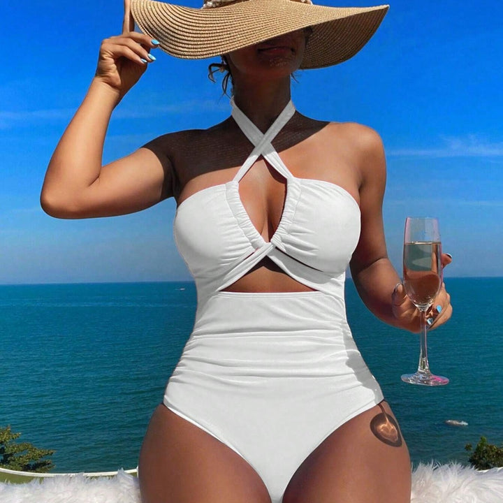 Women's one-piece swimsuit with innovative cut-out design and playful bow band Mune Fashion