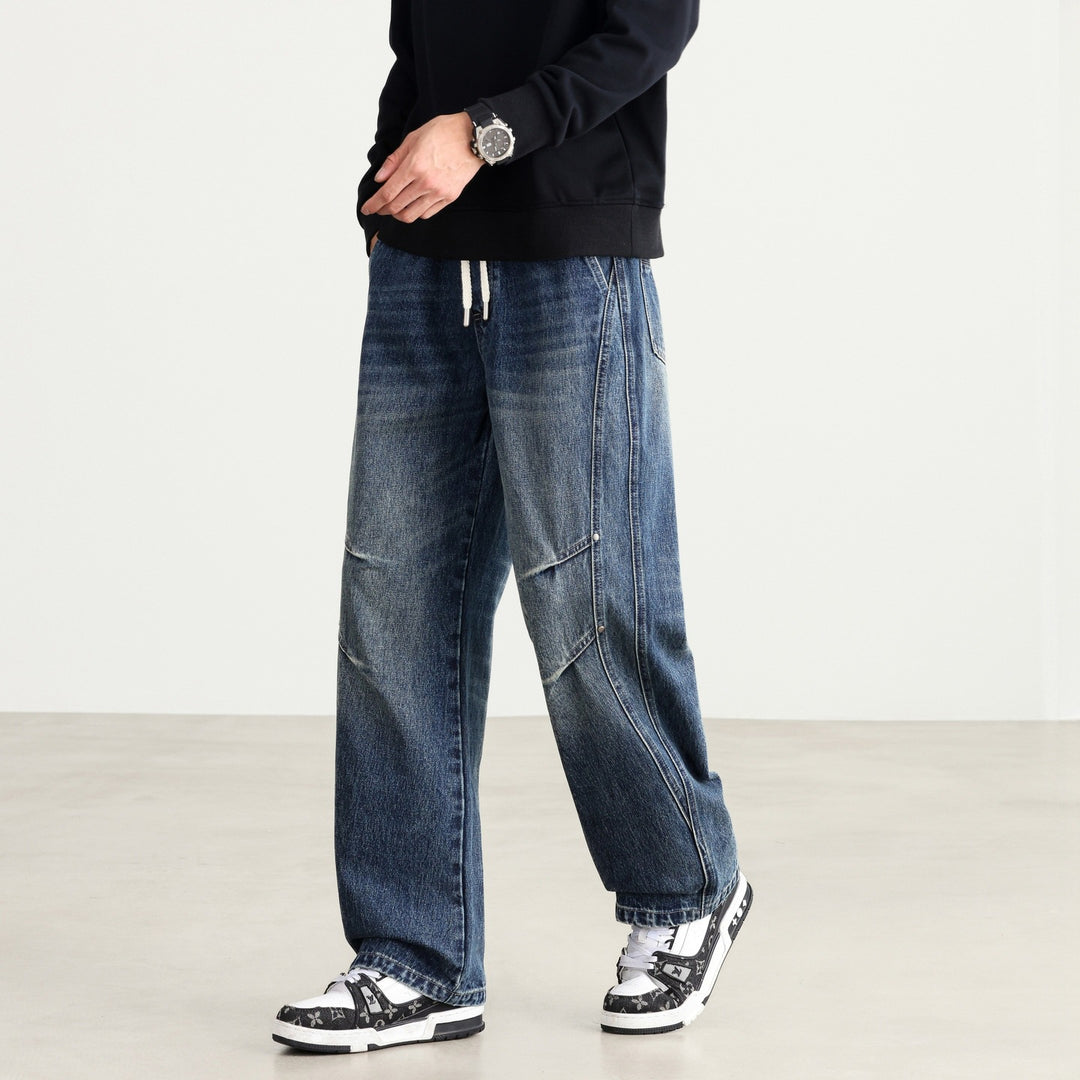 Men's Loose Fit Denim Pants with Drawstring Waistband, Panel Seams and Used Wash Mune Fashion