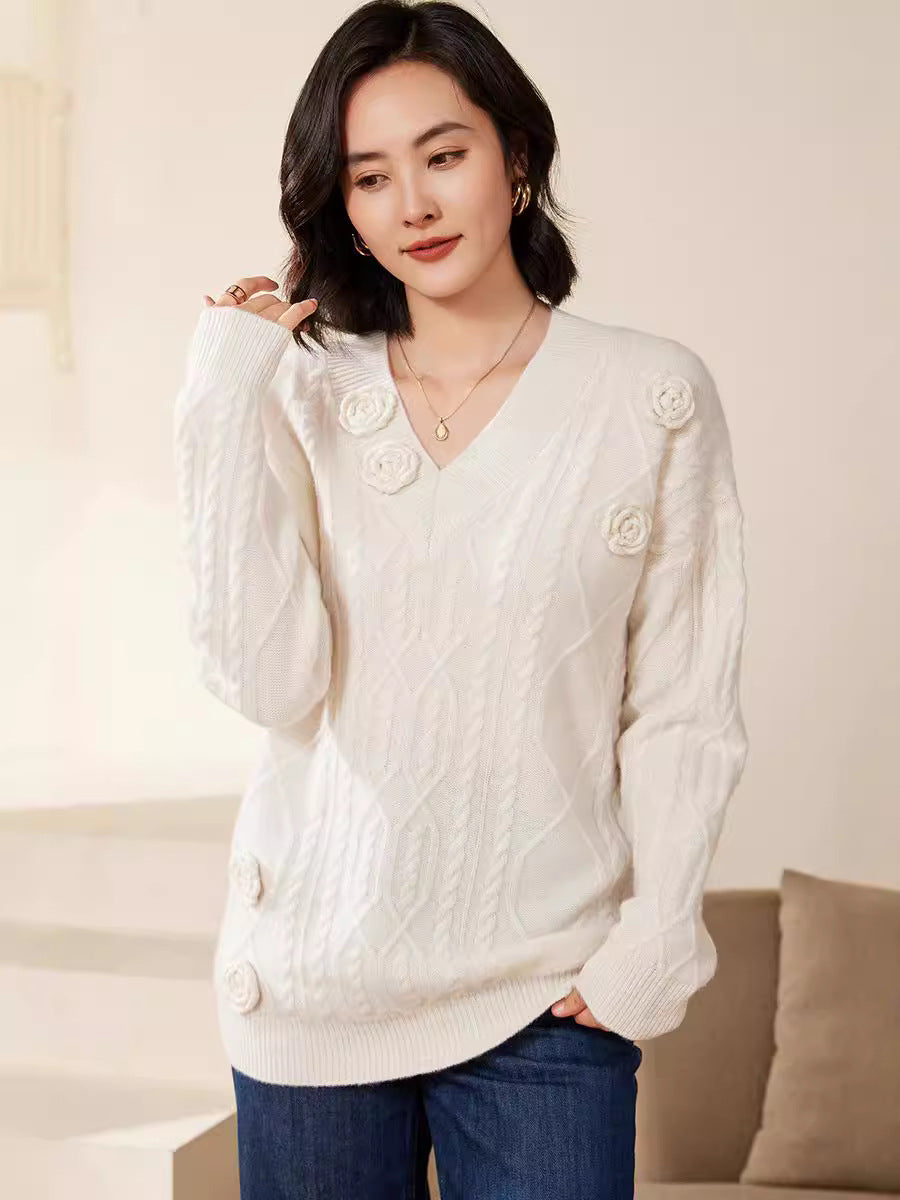 Women's cable knit V-neck sweater with three-dimensional floral appliqués made from soft wool blend Mune Fashion