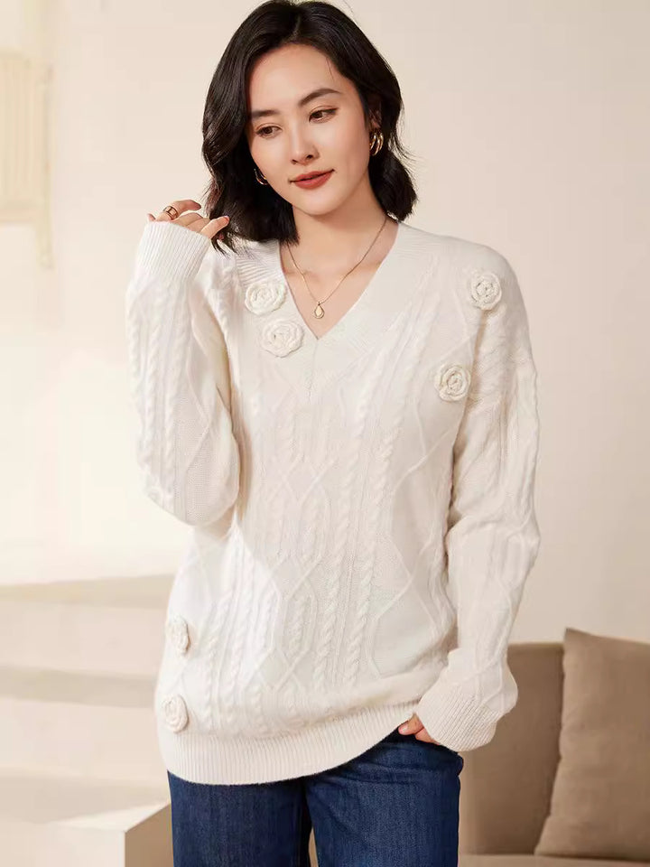 Women's cable knit V-neck sweater with three-dimensional floral appliqués made from soft wool blend Mune Fashion