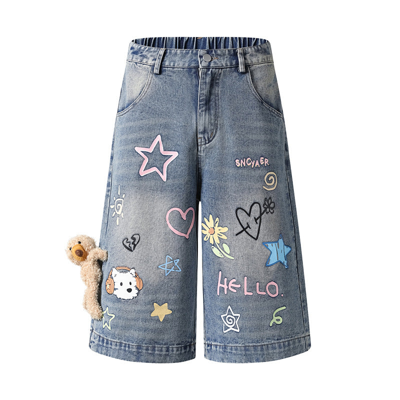 Women's playful denim culotte shorts with a high comfort waistband, allover doodle print & teddy pendant Mune Fashion