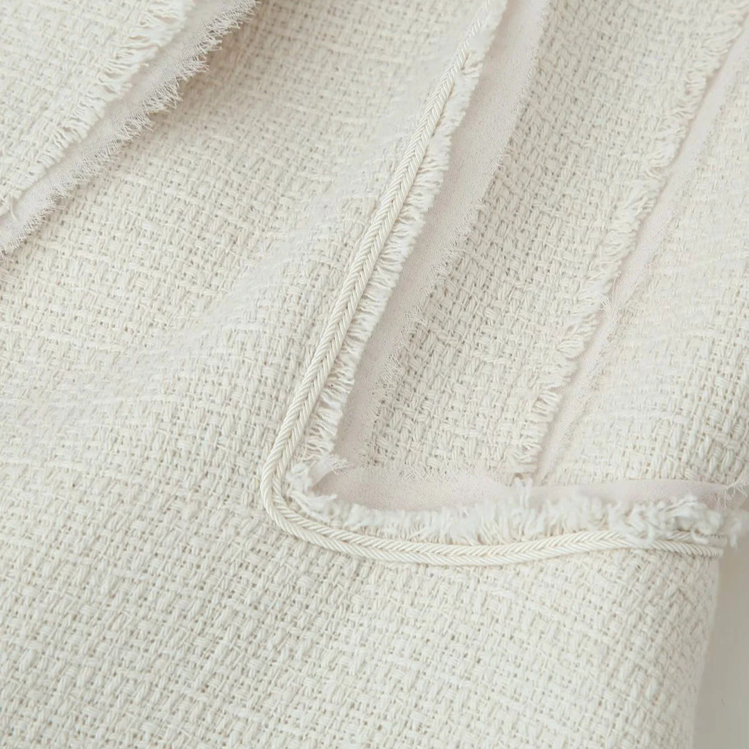 Ladies tailored bouclé jacket with stand-up collar, decorative strap, and subtle fringes Mune Fashion