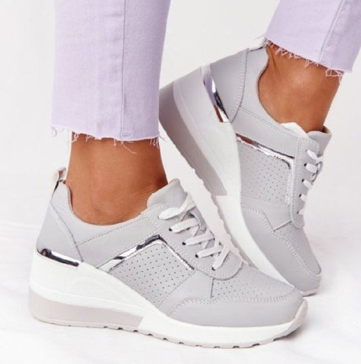 Women's wedge sneakers with perforated upper material, padded comfort collar and reflective metal details Mune Fashion