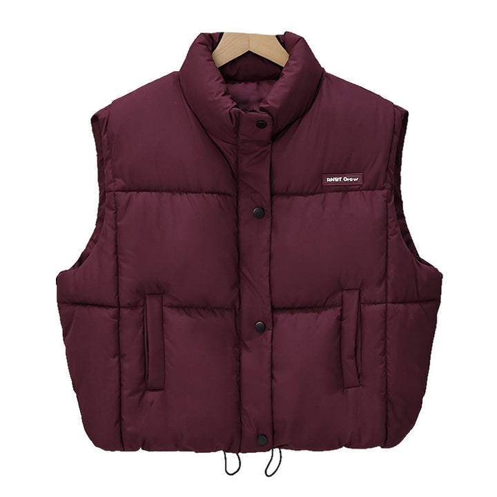 Women's short cut thermo quilted vest with high stand-up collar, snap button front and adjustable drawstring hem Mune Fashion