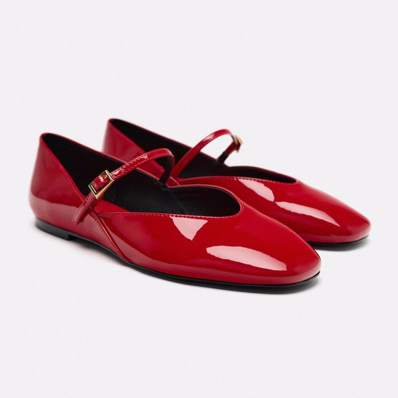 Women's elegant patent leather Mary Jane ballerina flats with a fine metal buckle and pointed toe cap.