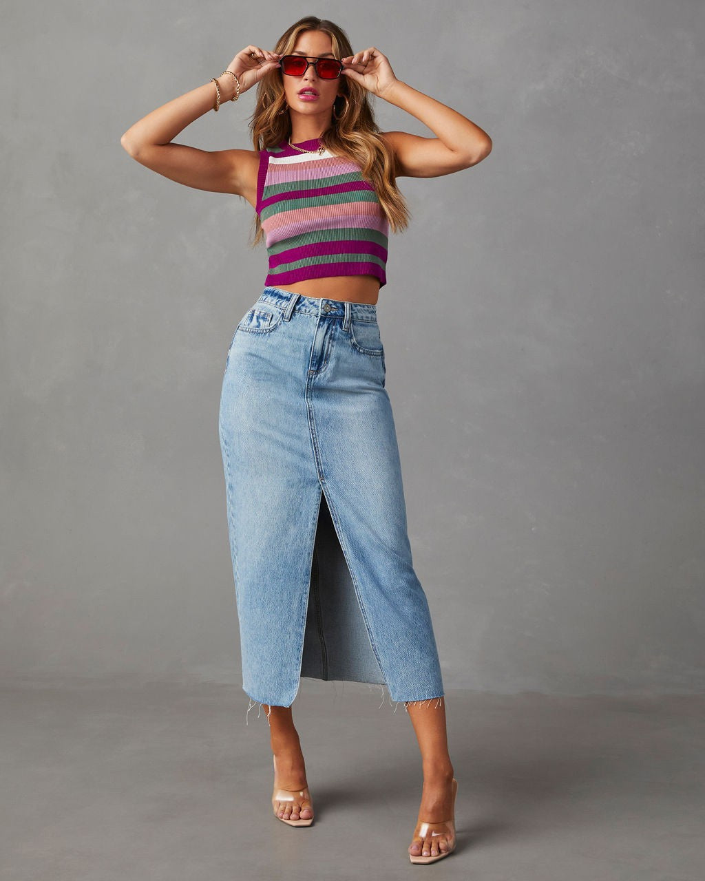 Women's high-waisted midi denim skirt with center front slit and raw hem Mune Fashion
