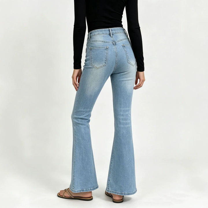 Ladies high-waisted jeans with a narrow hip area and wide flare with elastic waistband Mune Fashion
