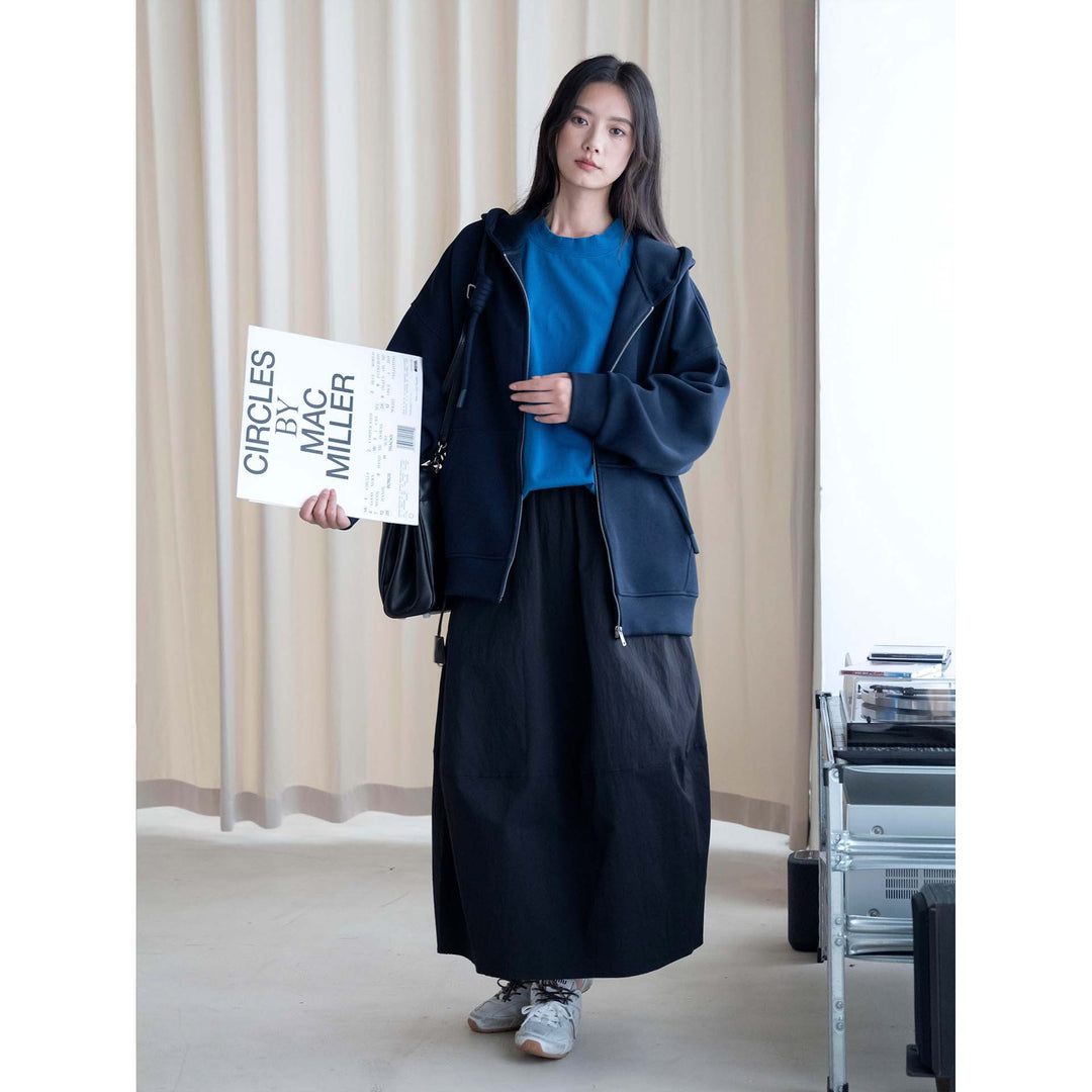 Women's midi skirt with high elastic waistband, flowing wide design and practical side pockets Mune Fashion