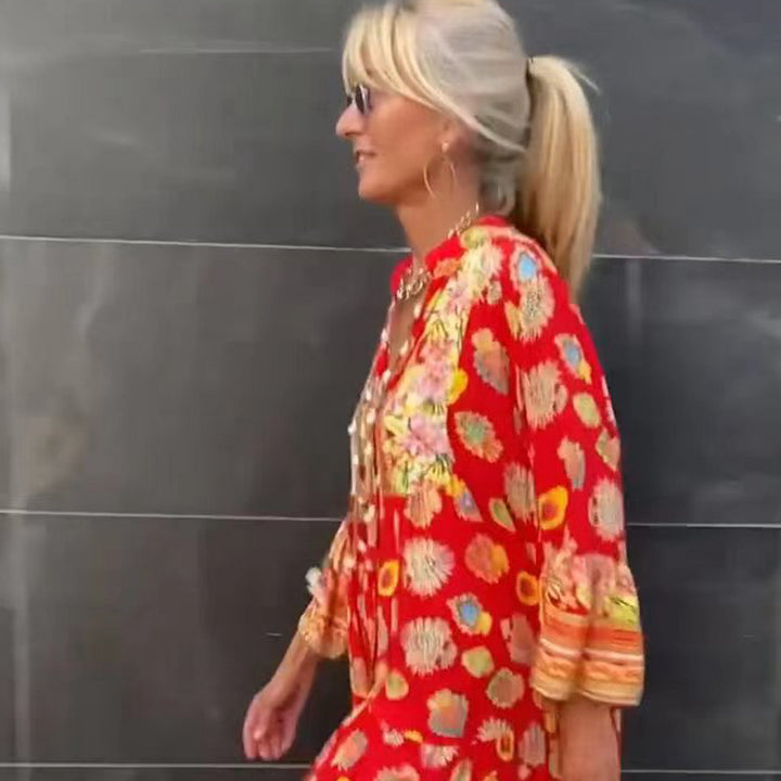 Women's airy kaftan midi dress with folk-inspired border print, V-neckline, tassel ties, and flounce bell sleeves Mune Fashion