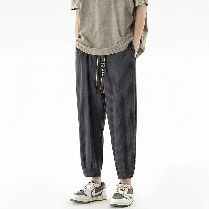 Men's loose-fitting leisure pants with drawstring, fine ribbed structure, and buttoned cuffs Mune Fashion