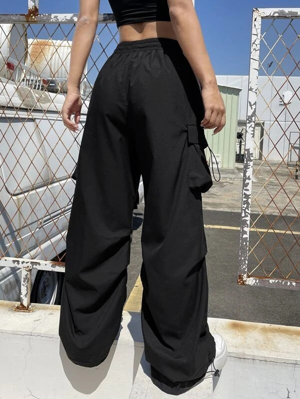 Women’s wide cargo pants with drawstring waist, multiple pockets, and adjustable hem Mune Fashion