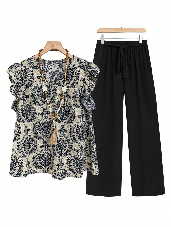 Women's two-piece ensemble with ruffled print blouse and wide waist trousers model Mune Fashion