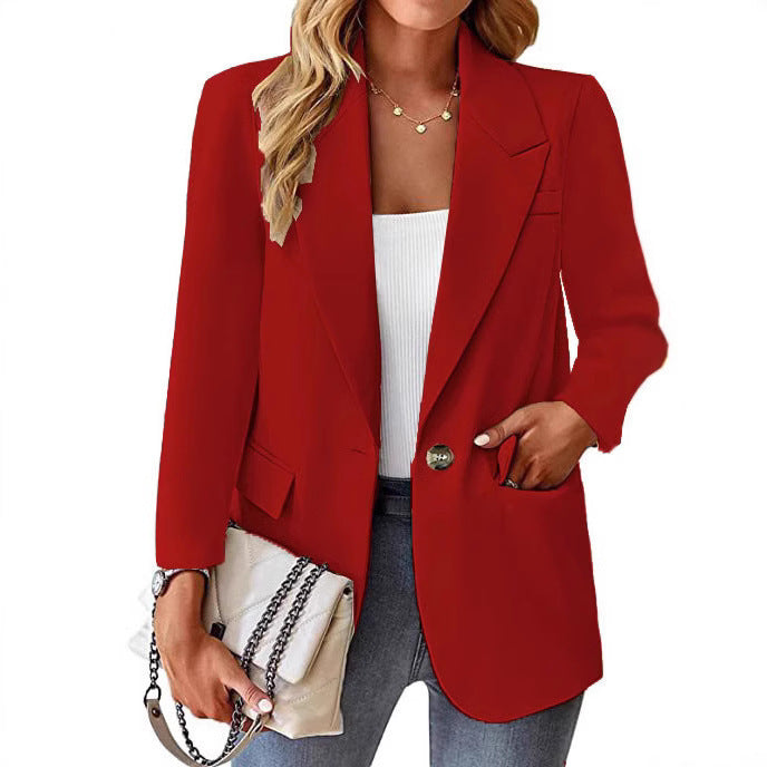 Ladies longline blazer in oversized style with a striking lapel, metal button, and patch pockets Mune Fashion