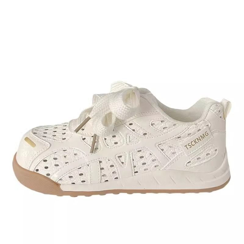 Ladies sporty platform sneakers with perforated upper material and decorative bows Mune Fashion