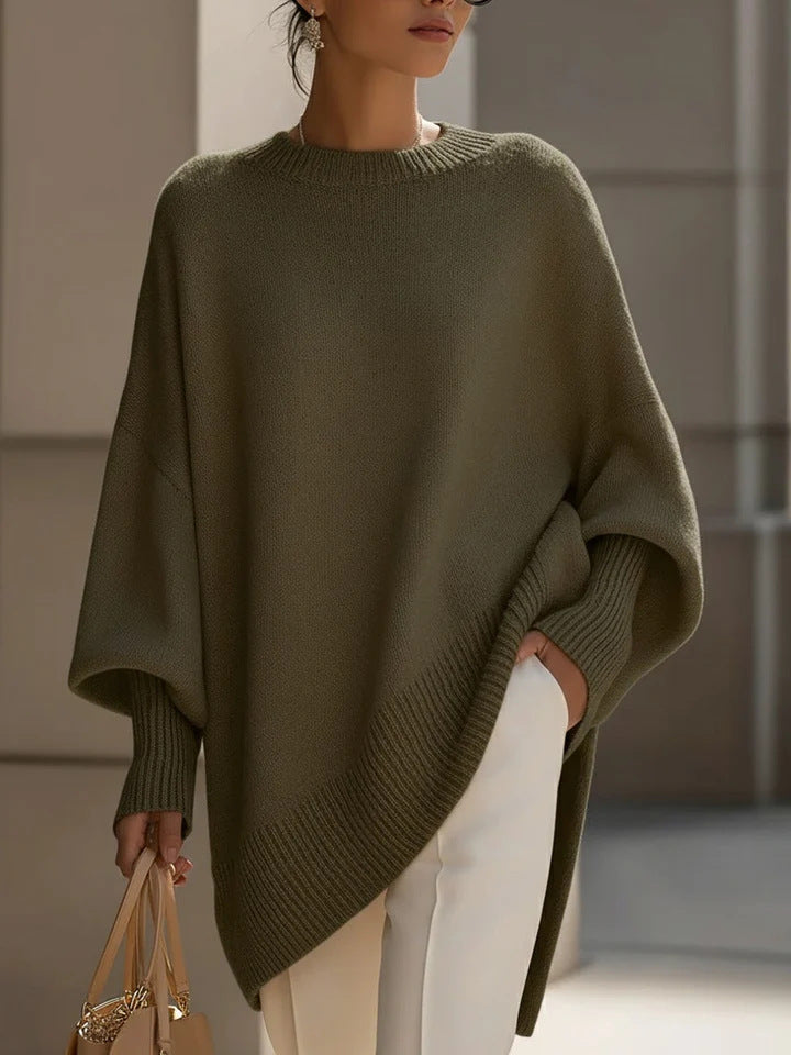 Women's oversized knit poncho with asymmetrical hem and ribbed sleeves Mune Fashion