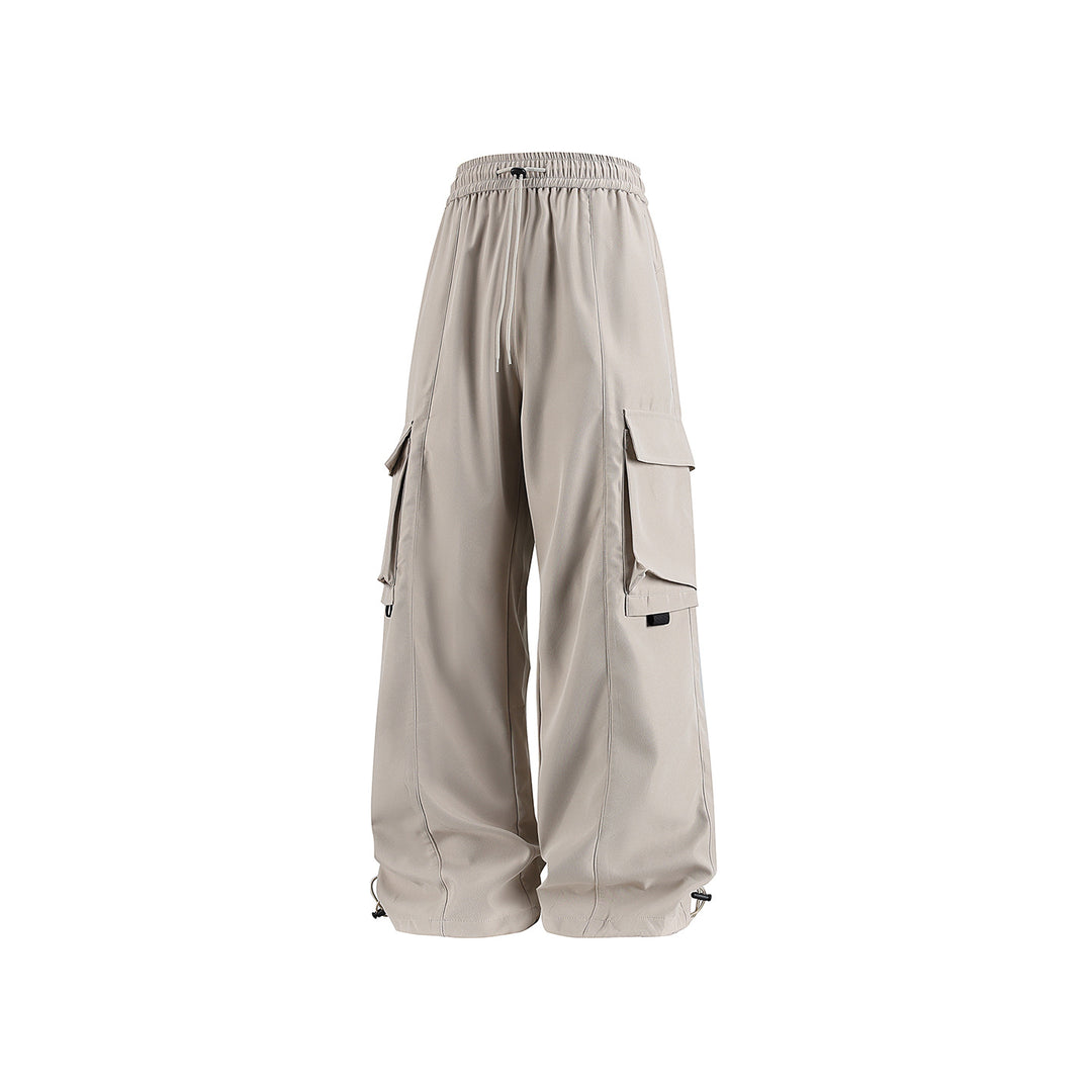 Men's wide utility cargo pants in baggy cut with drawstring waistband, large flap pockets, and adjustable leg hems Drune