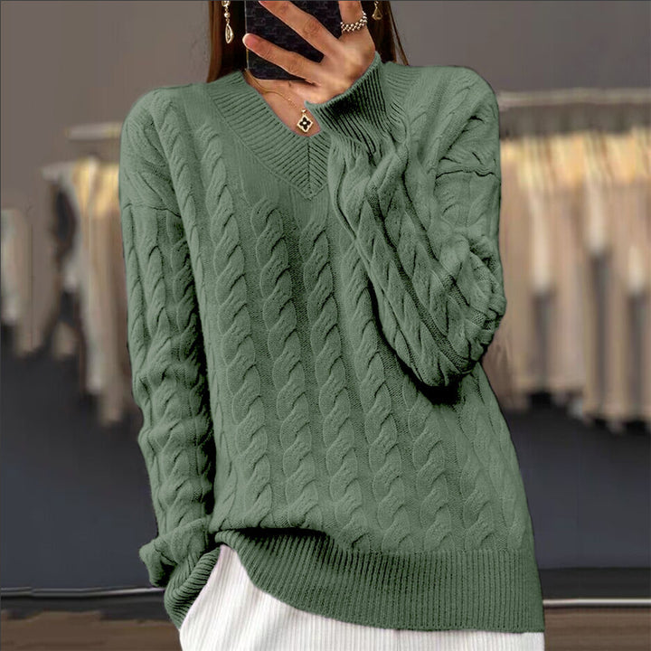 Women's soft draping cable knit sweater with V-neck, oversized cut and ribbed hem Mune Fashion