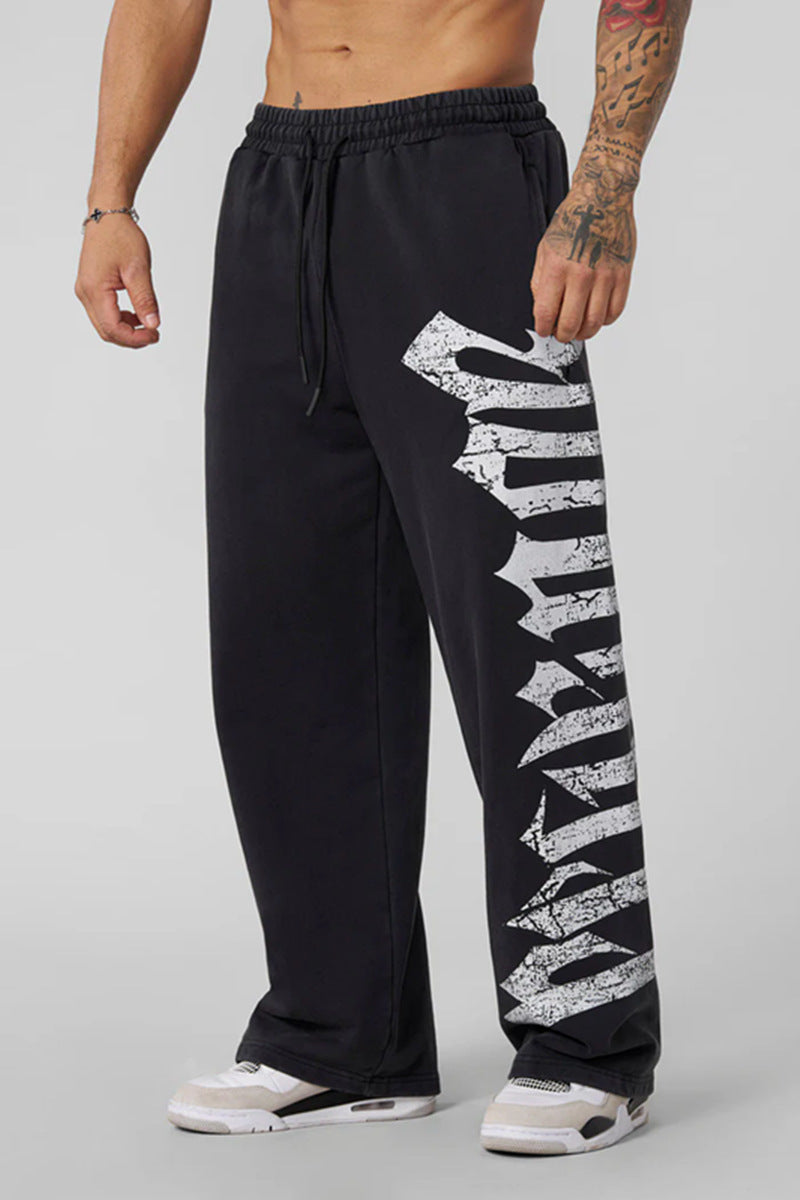 Men's wide sweatpants made of brushed fleece with side vintage print and drawstring waistband Mune Fashion