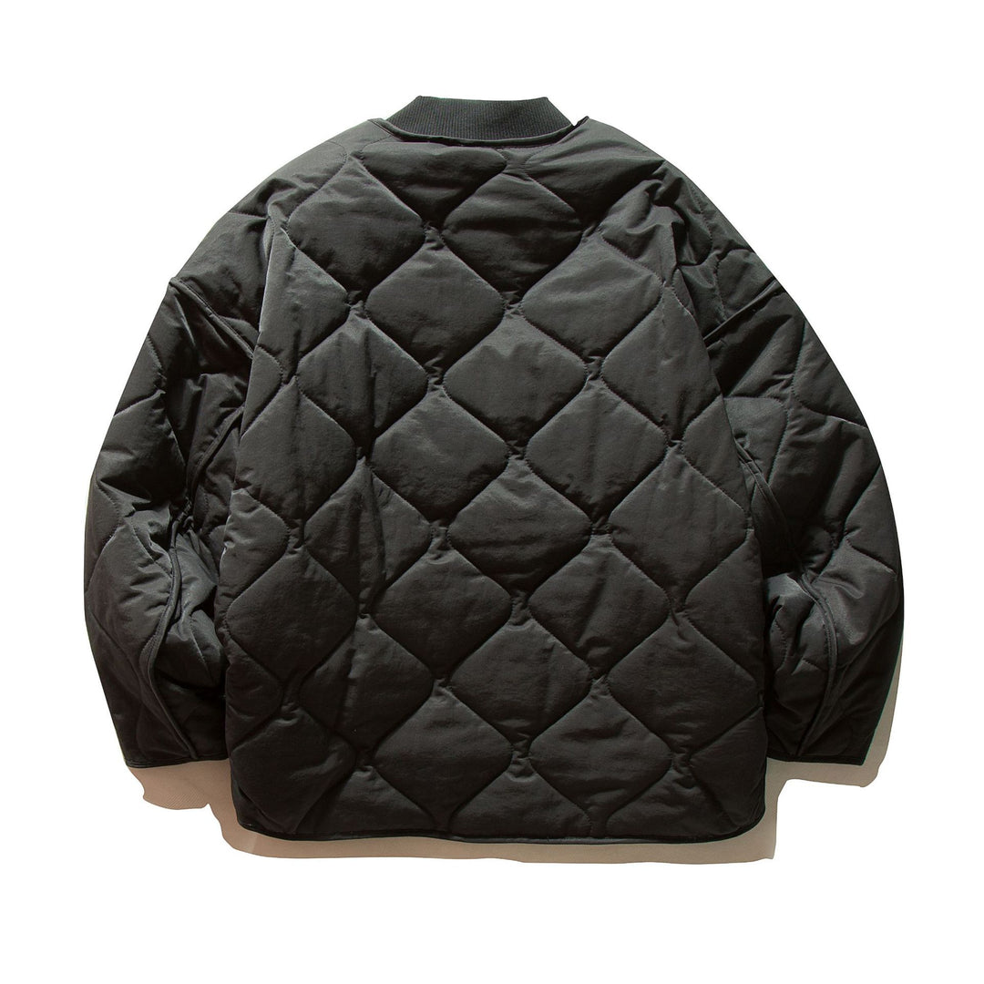 Unisex Short quilted bomber in boxy cut with ribbed collar and extra large flap pockets Mune Fashion