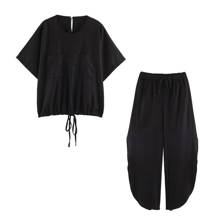 Ladies loose-fitting harem pants with drawstring waistband, mid-slit, and rounded hem Mune Fashion