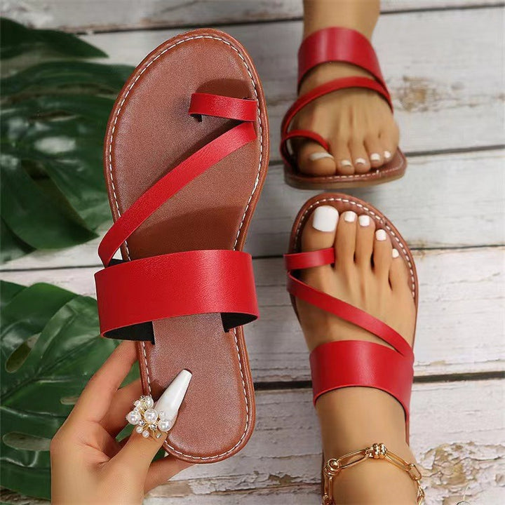 Women's flat faux leather thong sandal with crisscross straps and padded comfort footbed Mune Fashion