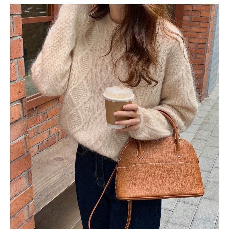 Women's structured leather handbag with detachable shoulder strap and rounded body shape Mune Fashion