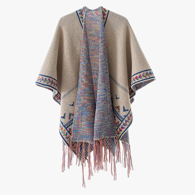 Women's chunky knit poncho with woven ethnic trim and fringes Mune Fashion