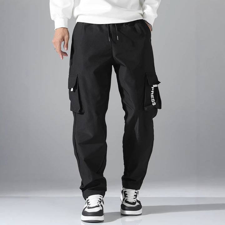 Men's cargo joggers with elastic waistband, side flap & zipper pockets Mune Fashion