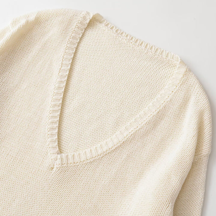 Women's chunky knit sweater with deep V-neck and oversized cut Mune Fashion