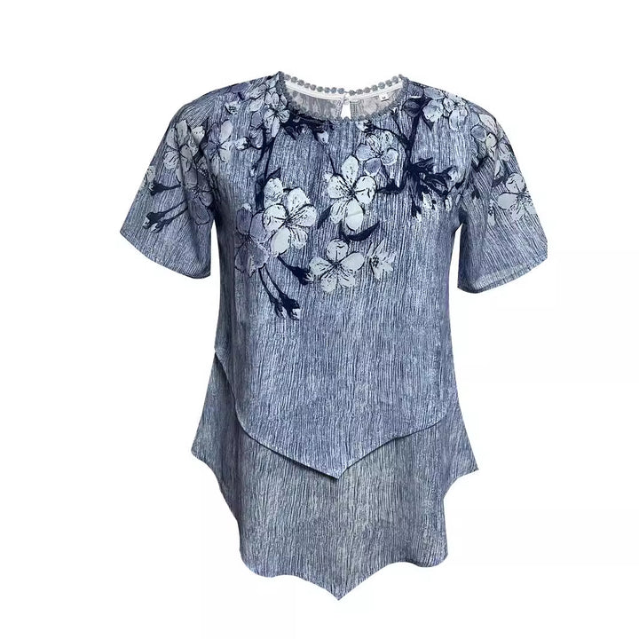 Women's two-layer blouse dress with asymmetrical tiered hem, floral print yoke, and wing sleeves Mune Fashion