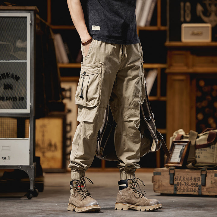 Men's military-inspired cargo pants with elastic tunnel drawstring waistband, flap and zipper pockets Mune Fashion