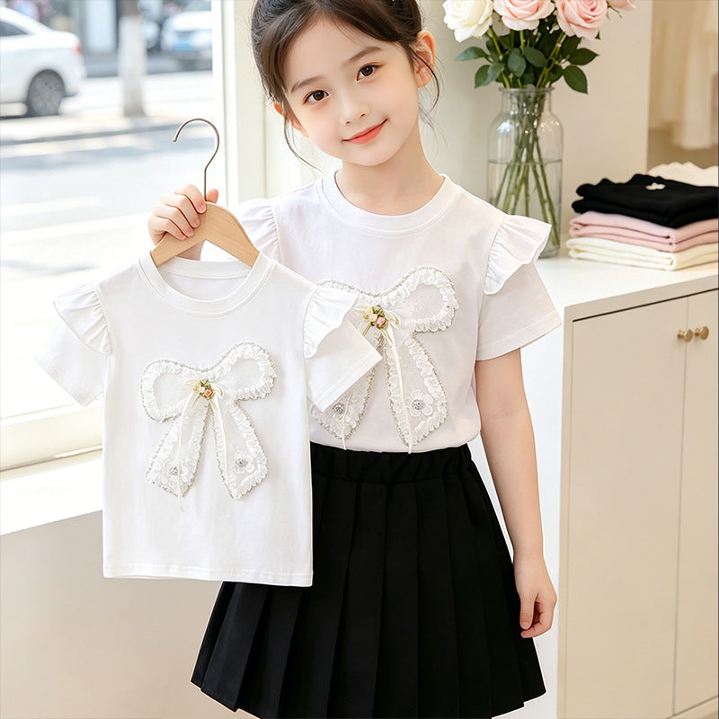 Girl's T-shirt with romantic bow motif and ruffle details Mune Fashion