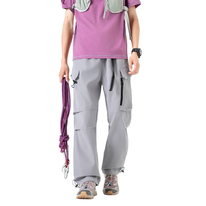 Unisex Wide technical cargo pants with multi-function pockets, drawstring and adjustable leg hems Drune