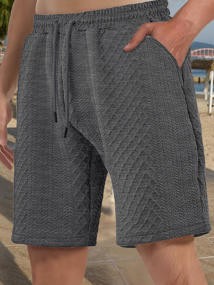 Men's textured beach bermuda shorts made of waffle jersey with elastic drawstring waistband and slanted pockets Mune Fashion