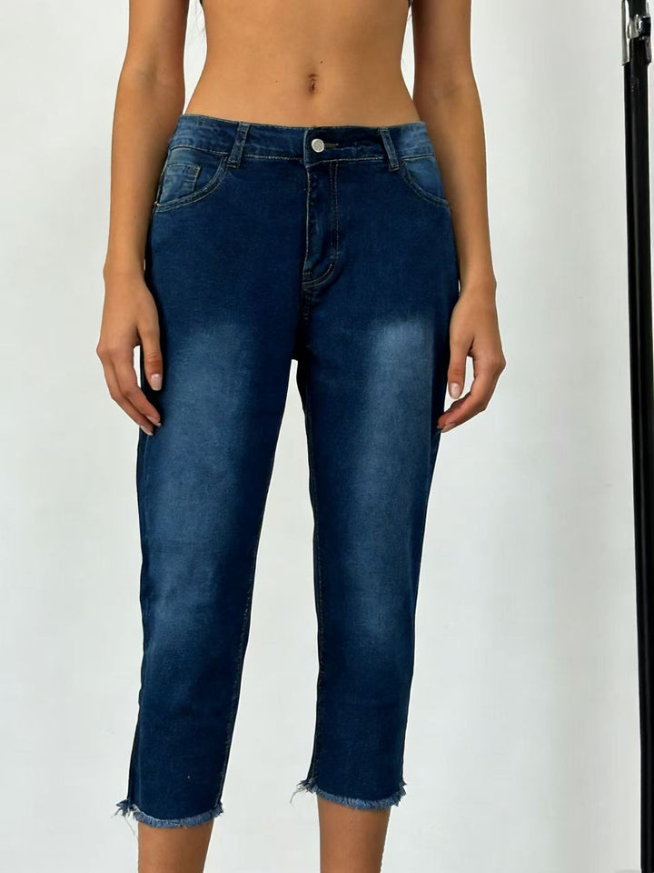 Women's narrow ankle-length jeans with raw fringe finish and mid-rise waist Mune Fashion