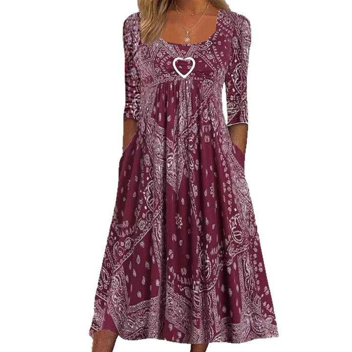 Women's maxi dress with paisley bandana pattern, empire seam, gathered underbust area, and side pockets Mune Fashion