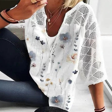Women's V-neck tunic with lace-knit sleeves and subtle watercolor floral print Mune Fashion