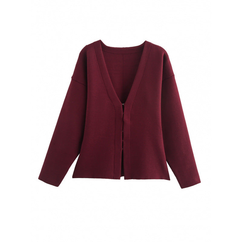 Women loosely fitted fine knit cardigan with deep V-neck and concealed button placket Mune Fashion