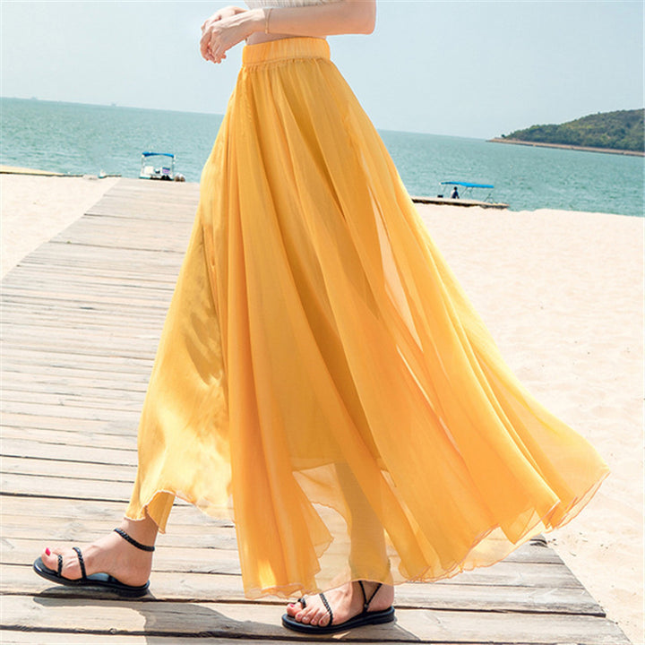 Women's flowing maxi skirt made of chiffon with elastic waistband and layered ruffle Mune Fashion