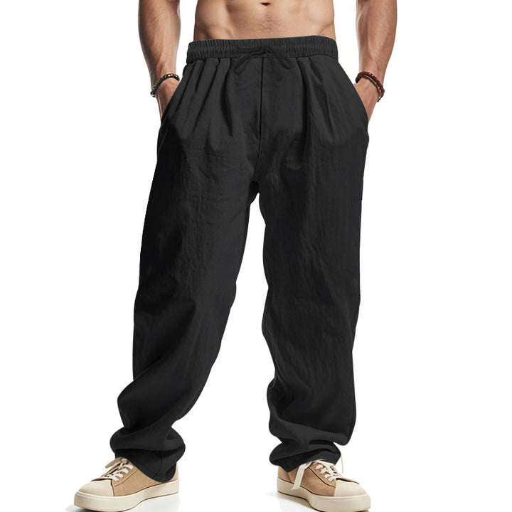 Men's loose leisure pants with elastic waistband, drawstring, and deep side pockets Mune Fashion