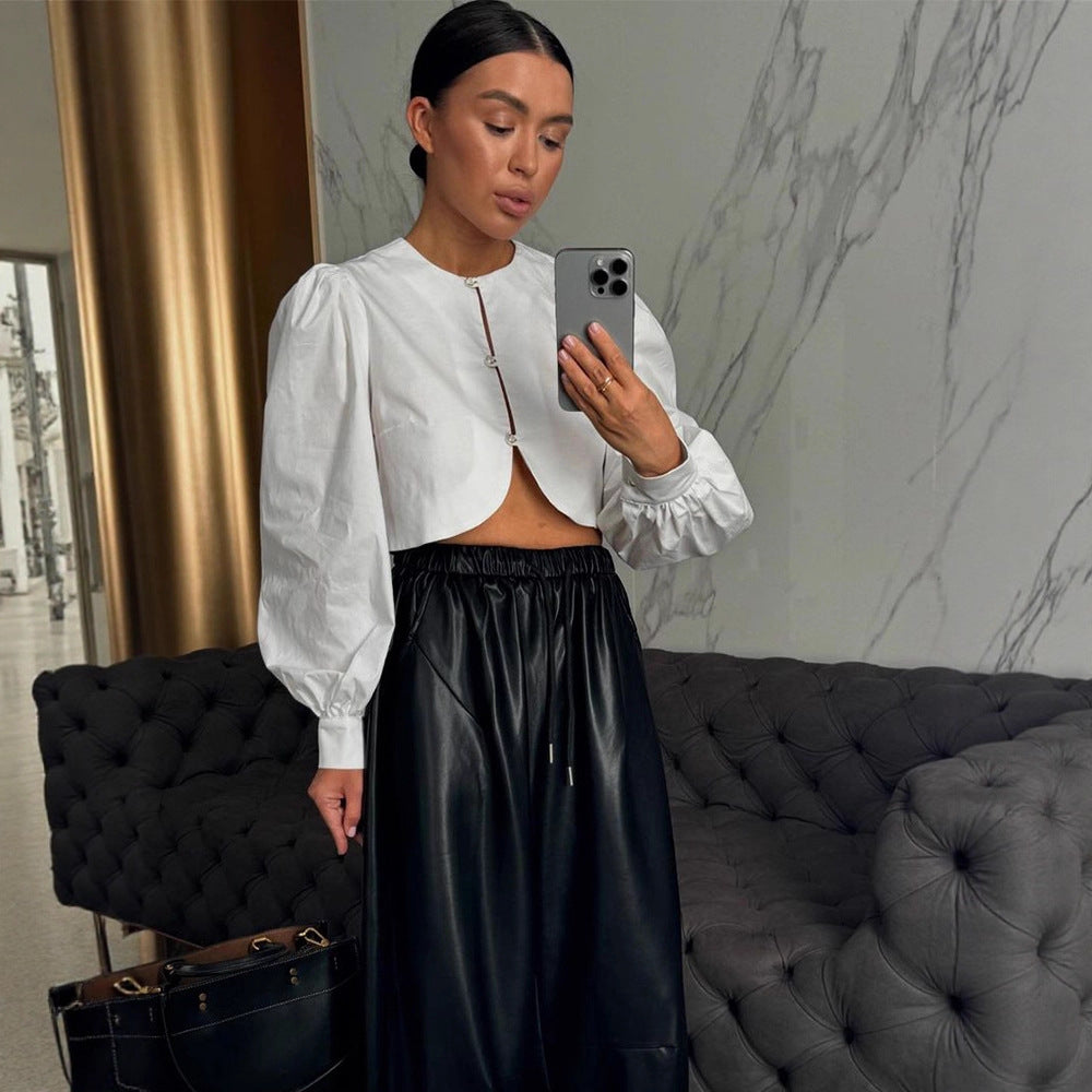 Women short-cut blouse with curved hem edge and voluminous puff sleeves Mune Fashion