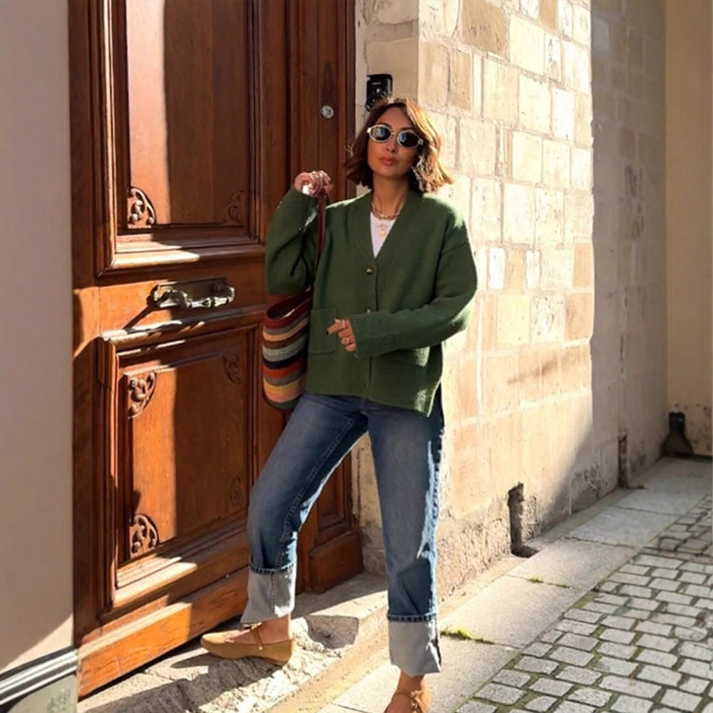 Women's oversized knit cardigan with decorative button placket, patch pockets, and elongated cuffs Mune Fashion