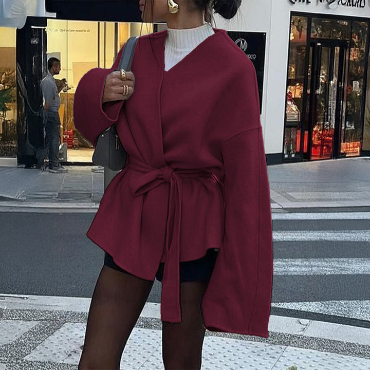 Women’s light wrap coat with tie belt, dropped sleeves and feminine waist emphasis Mune Fashion