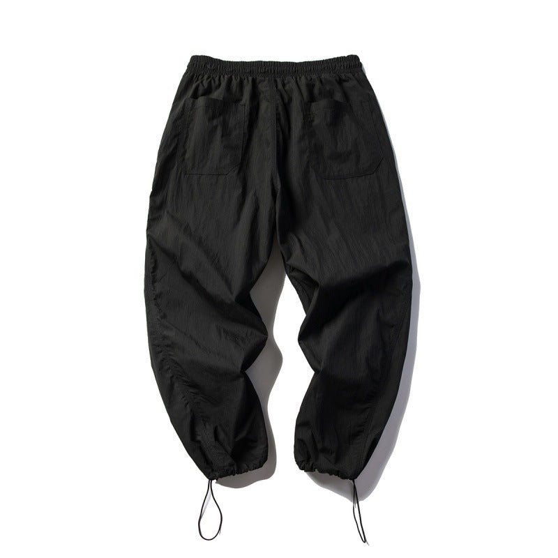 Unisex Technical Cargo Pants in Baggy Cut with Drawstring Waist and Adjustable Leg Closures Mune Fashion