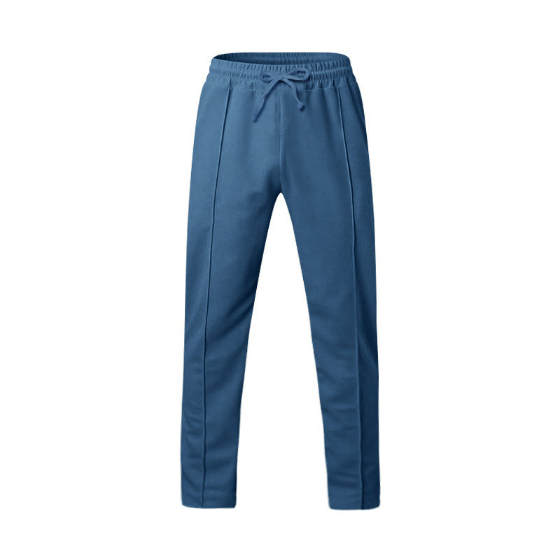 Men's tapered jogging pants with decorative stitching, elastic drawstring waistband, and slim leg Mune Fashion