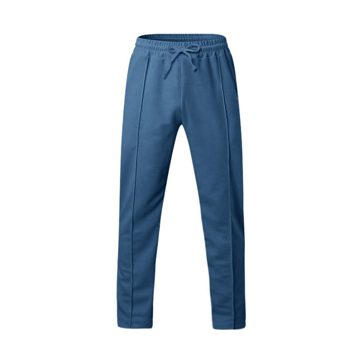 Men's tapered jogging pants with decorative stitching, elastic drawstring waistband, and slim leg Mune Fashion