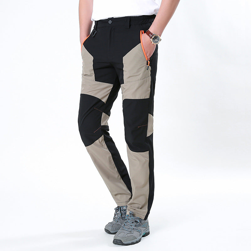 Men's functional trekking pants with reinforced knees, elastic waistband, and zipper pockets.
